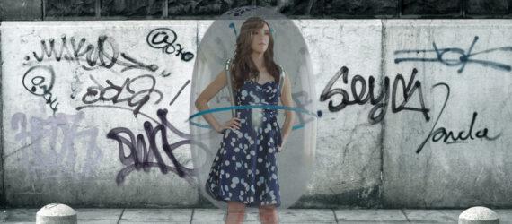 rendering of person wearing a bubble-like shield around their body in a public street