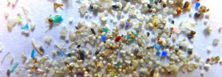 closeup of microplastic beads on a white background