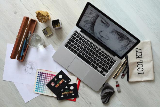 art supplies in front of a laptop