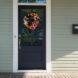 front door decorated with a tulip wreath