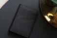 black vegan leather wallet on a table