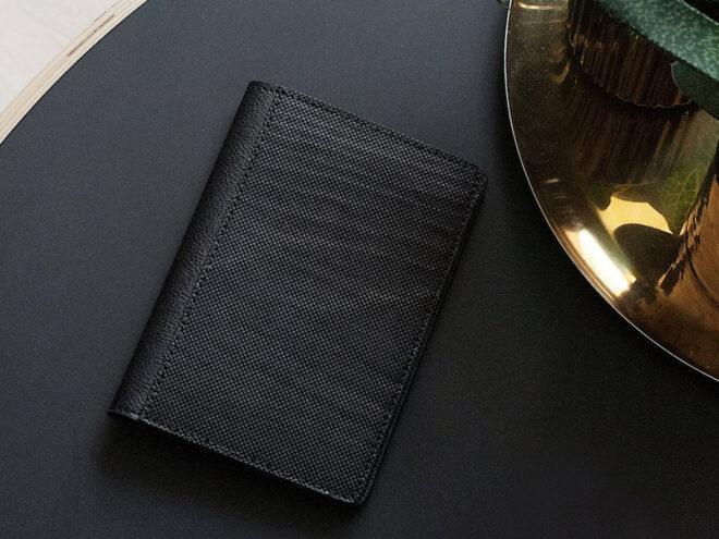 black vegan leather wallet on a table