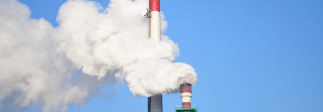smoke stacks against a blue sky