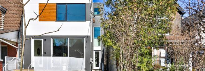 narrow, white three-story home