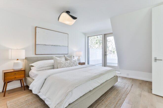 white bed in a white bedroom