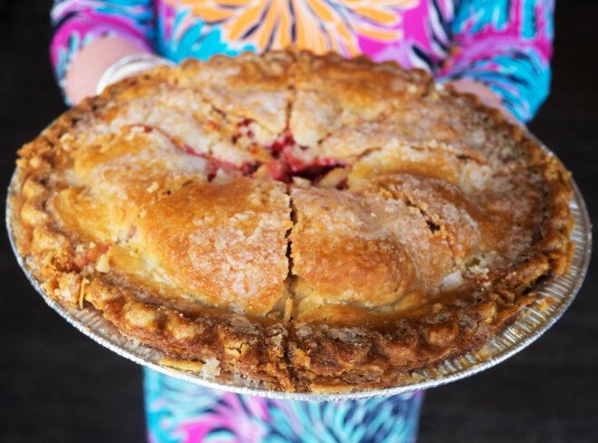 a person holding a pie