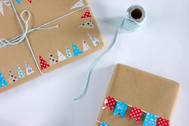 cardboard boxes with decorative tape and blue twine