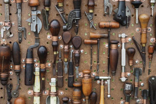 tools hanging from a pegboard