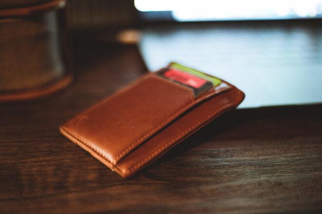 brown wallet on a wood table