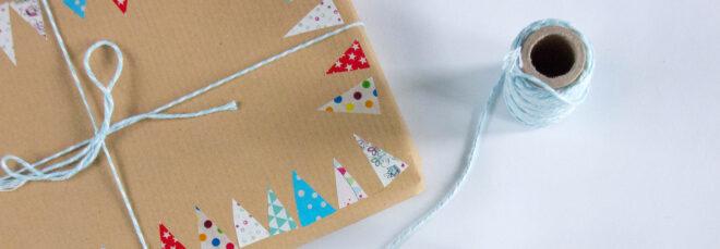 cardboard boxes with decorative tape and blue twine