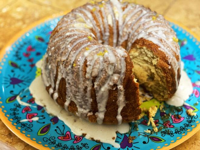 a lemon bundt cake on a blue plate