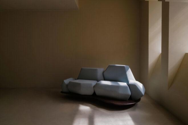 geometric light blue sofa in a beige room