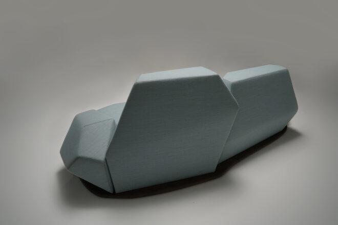 back of a geometric light blue sofa