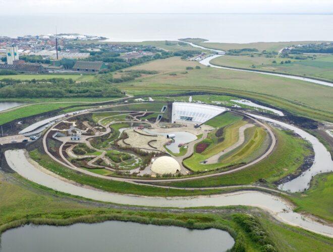 aerial view of round park with white ETFE structure and several pathways