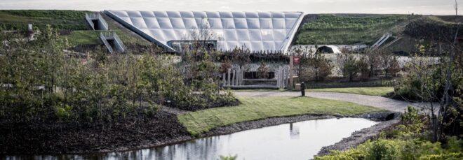 small pond in front of a white structure made from ETFE