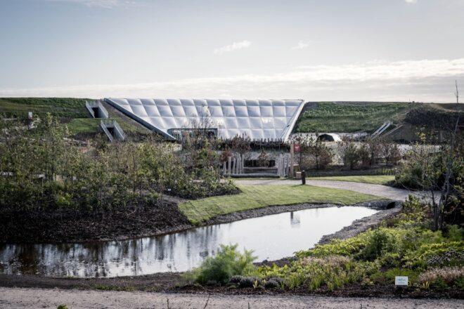 small pond in front of a white structure made from ETFE
