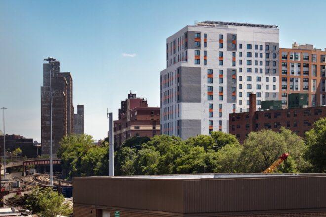 city skyline with a large gray and orange building