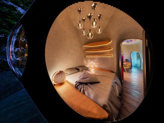 rendering of round room with a bed