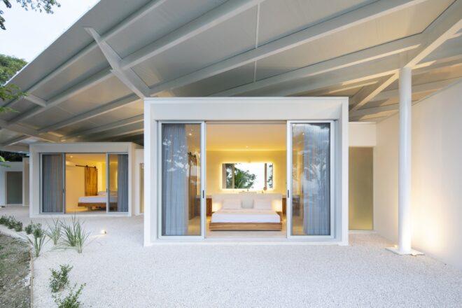 a block-like volume of the house with sliding glass doors