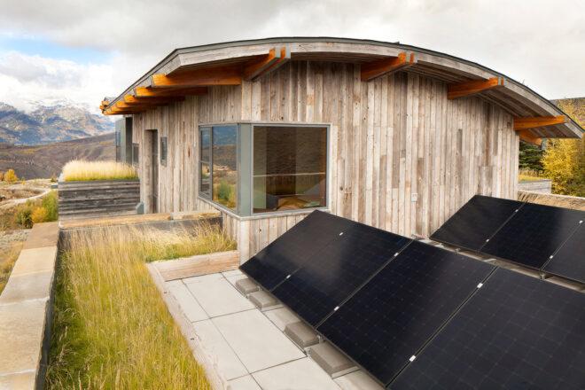 sets of solar panels on a green roof