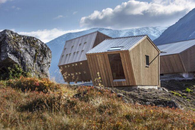 small wood cabins with sharply slanted roofs