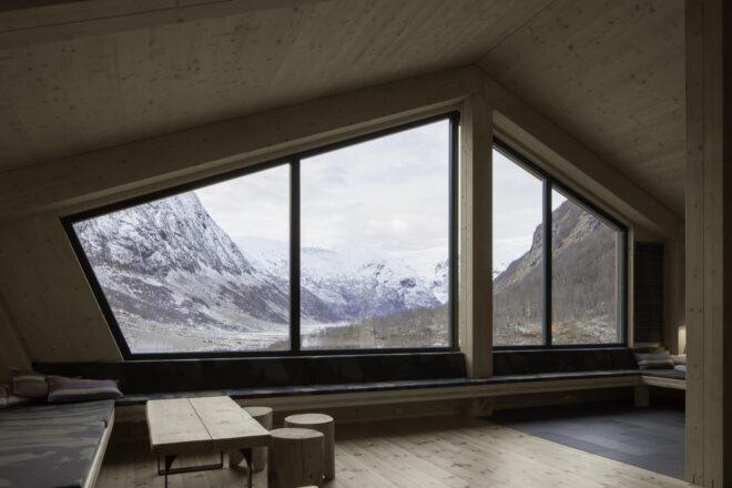 wood-lined room with large, geometric windows