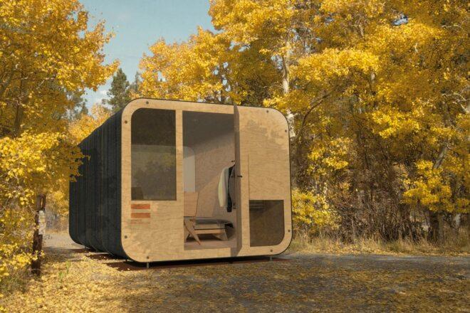 plywood cube building in a forest