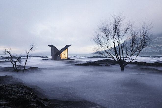 black cabin with two angled roofs near a mountain