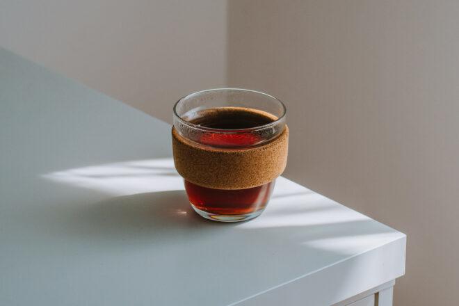 glass coffee cup with cork exterior