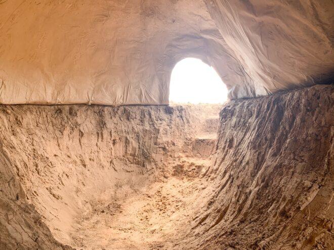 rammed-earth and paper dome interior with large opening