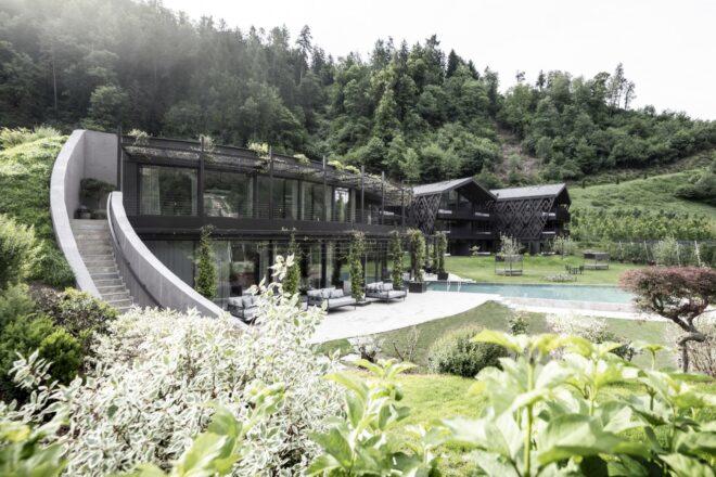 lush green roof over a large black metal and glass building