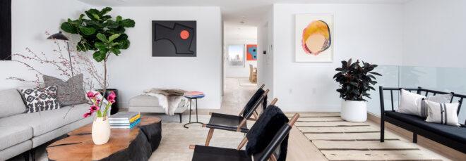 white room with black fur chairs and gray sofa