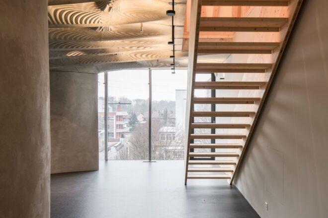 stairs in front of glass wall