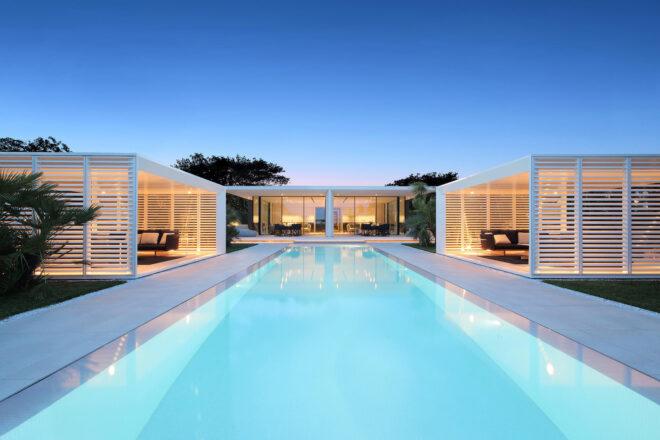long pool with cabanas on either side