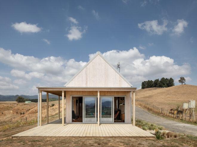 gabled home with light wood exterior