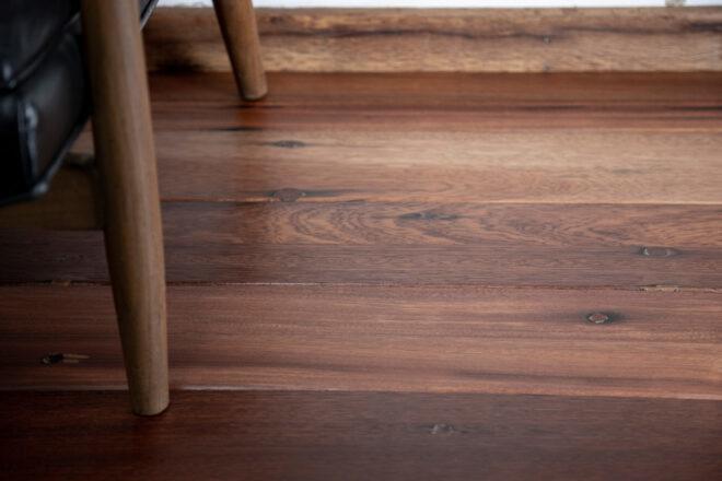 wood chair legs on dark wood floors
