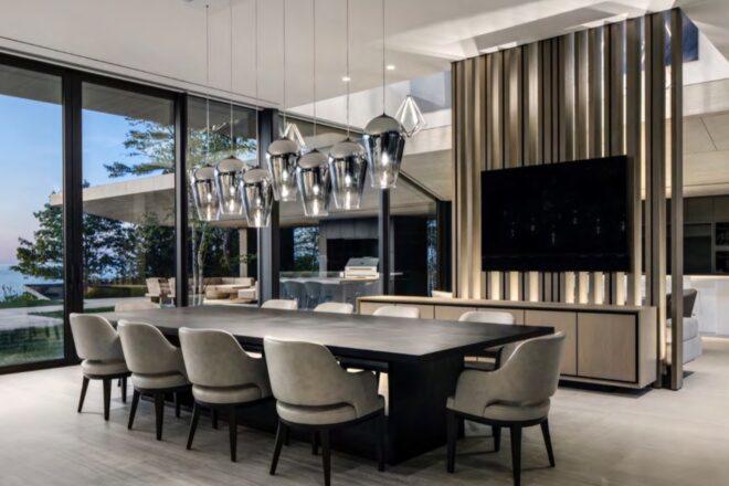 large black dining table with plush beige chairs