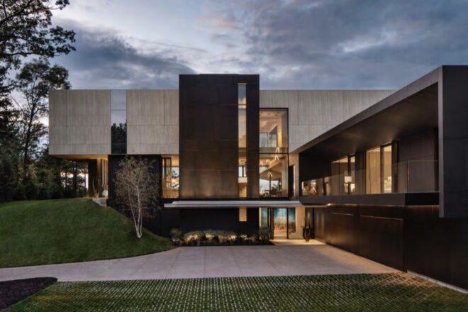 large black and concrete home with large walls
