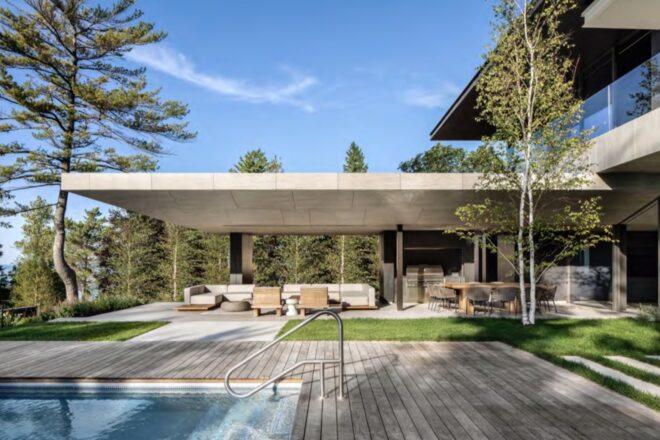 beige sectional on outdoor patio near a pool