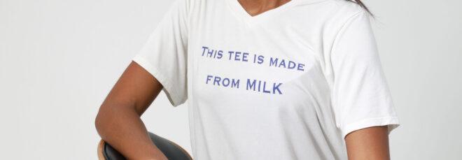 person wearing white T-shirt that reads, "This Tee Is Made From Milk"