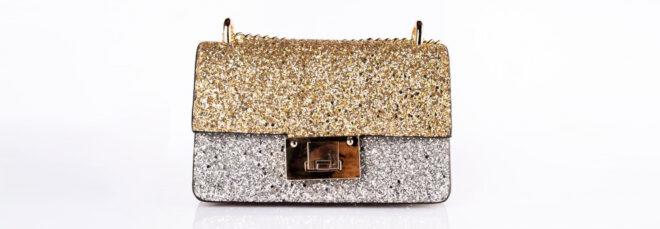 glitter gold and silver purse on white background