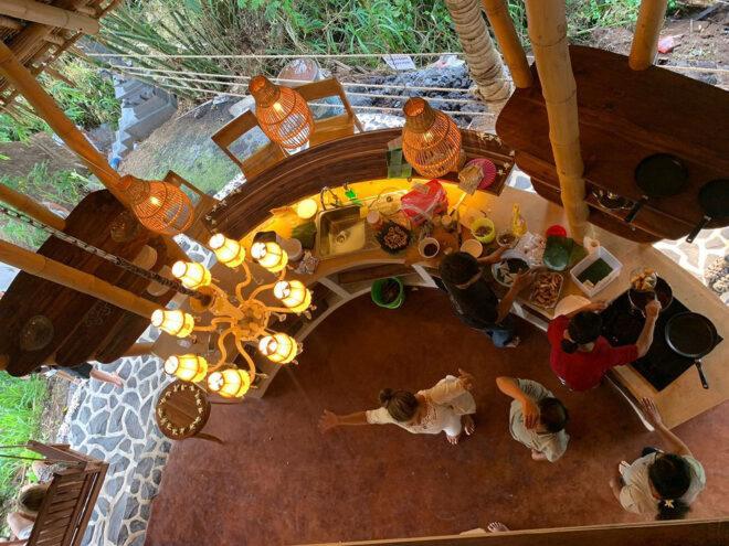 aerial view of people preparing food in covered outdoor kitchen