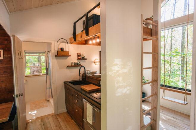 small gray kitchen inside a cabin