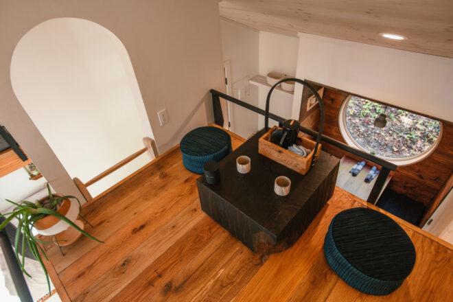 small dining table and pouf chairs on a loft