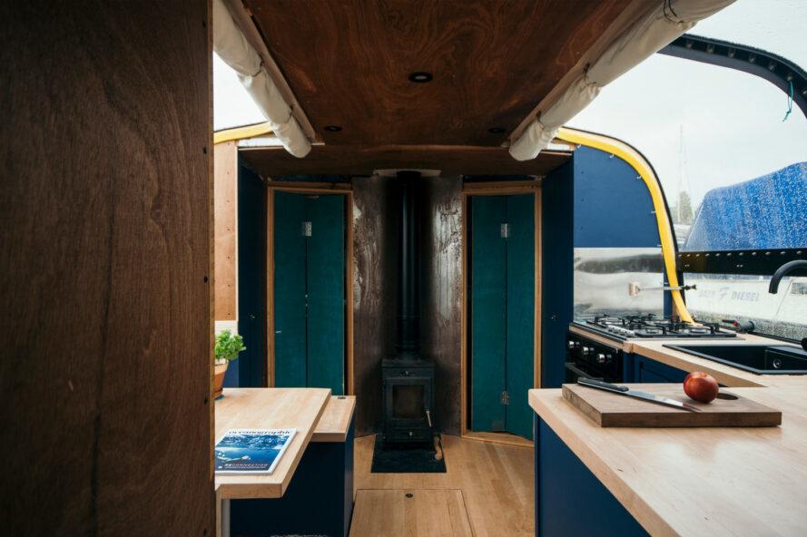 boat kitchen with wood counters and dark cabinets