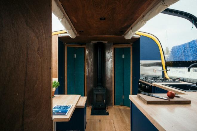 boat kitchen with wood counters and dark cabinets