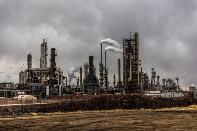 fossil fuel plant against cloudy skies