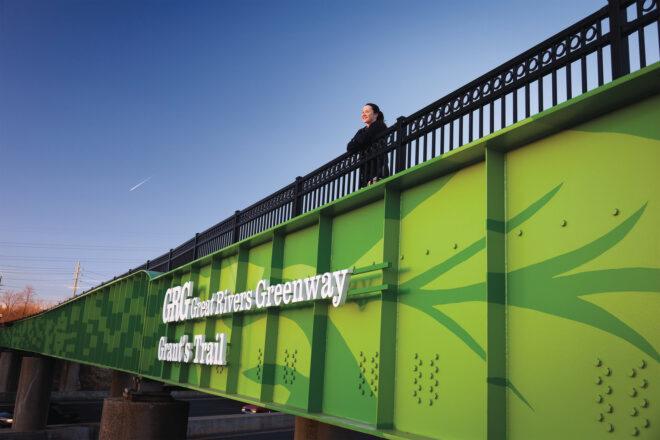 green bridge that reads, "Great Rivers Greenway Grant's Trail"