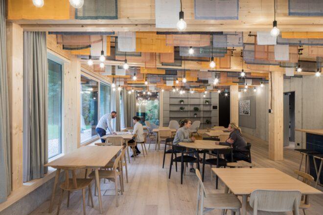 wood tables in a light wood office space