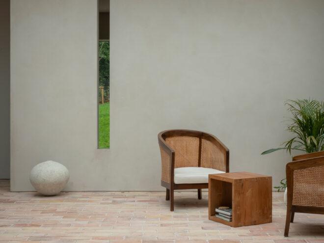 wicker chairs near small wood table